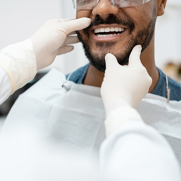 man smiling at dentist
